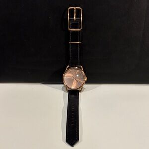 Nixon Black and Rose Gold Watch